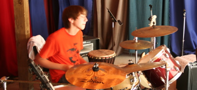 campers plays drums at summer rock camp