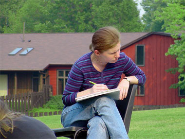 girl sketching at arts camp