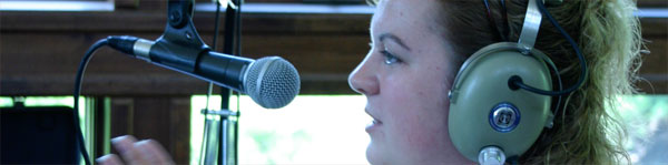 staffperson on the radio at arts camp
