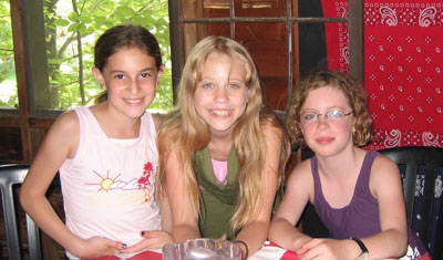 three girls at a meal at arts camp