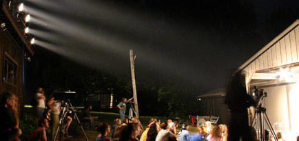Theater summer camp stage lights through mist at night