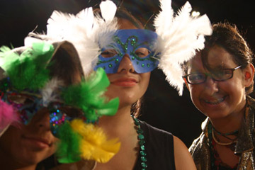 theater summer camp kids in feather masks