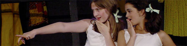 girls with bows acting at drama camp
